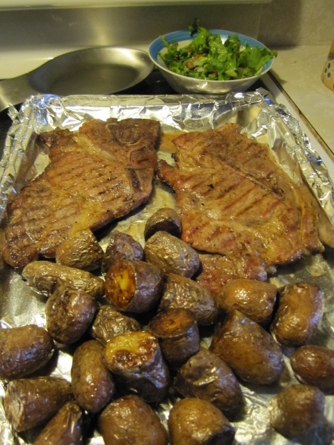 Pork steaks, fingerling potatoes, wilted lettuce salad.JPG