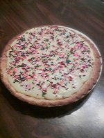 Finished Pie with 3 layers - chocolate, walnuts and custard with sprinkles on top.jpg