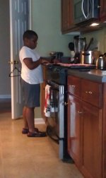Devaun in the kitchen getting cooking lessons!.jpg