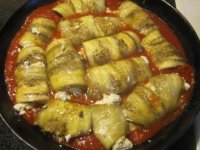 Eggplant involtini 3 - simmering in sauce.JPG